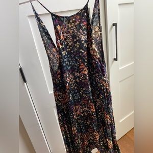 Multi color high neck with back cut out, button closure.